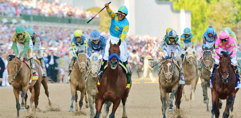 Horses racing during the Kentucky Derby at Churchill Downs