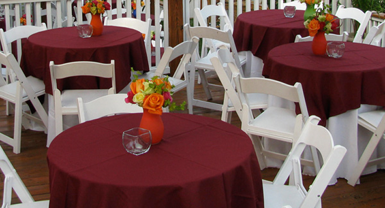 Corporate hospitality event setup with decorated tables and seating