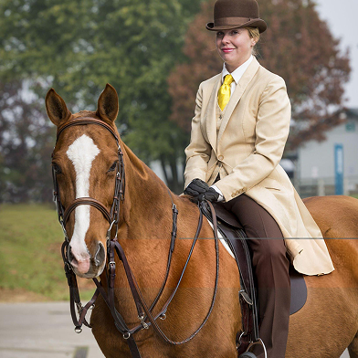 Woman in top hat on a horse